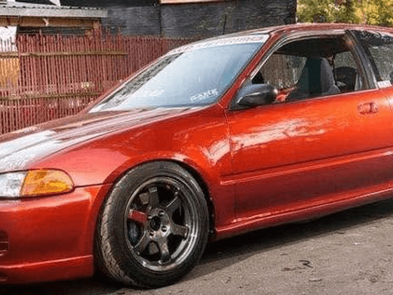 Candy orange paint job on a Honda Civic at our Jacksonville shop